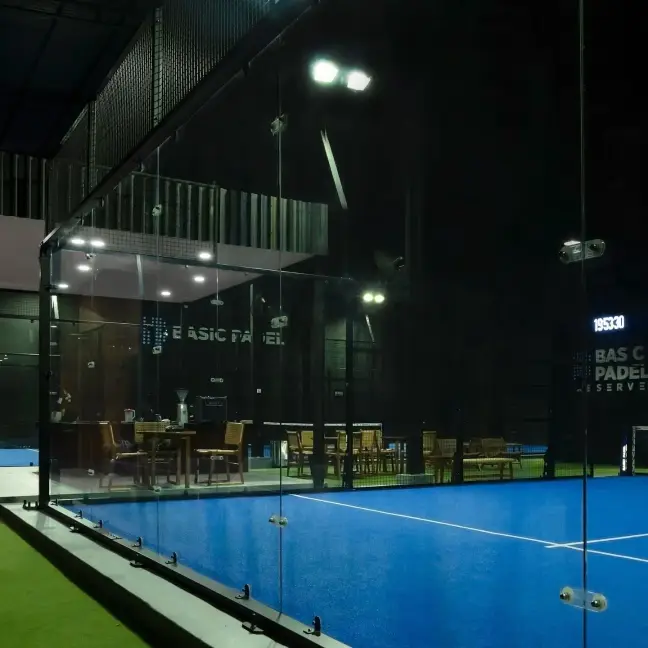 Court seen through glass with the lounge behind