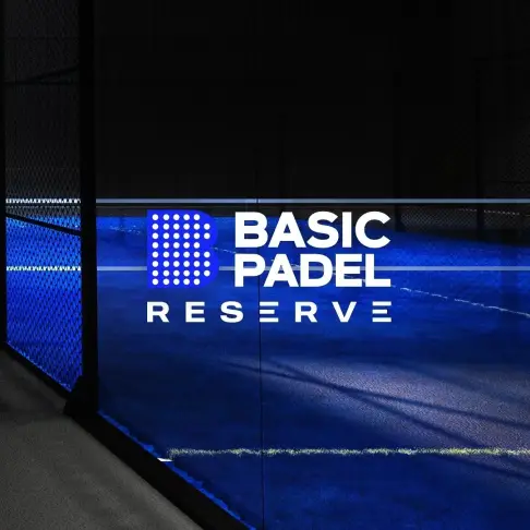 Basic Padel Reserve logo on the court wall