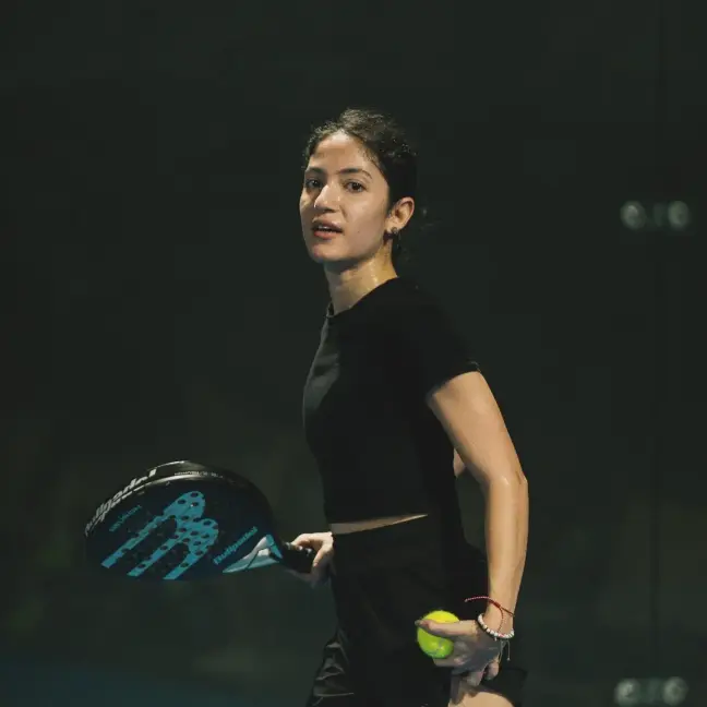 Player holding a racket and ball